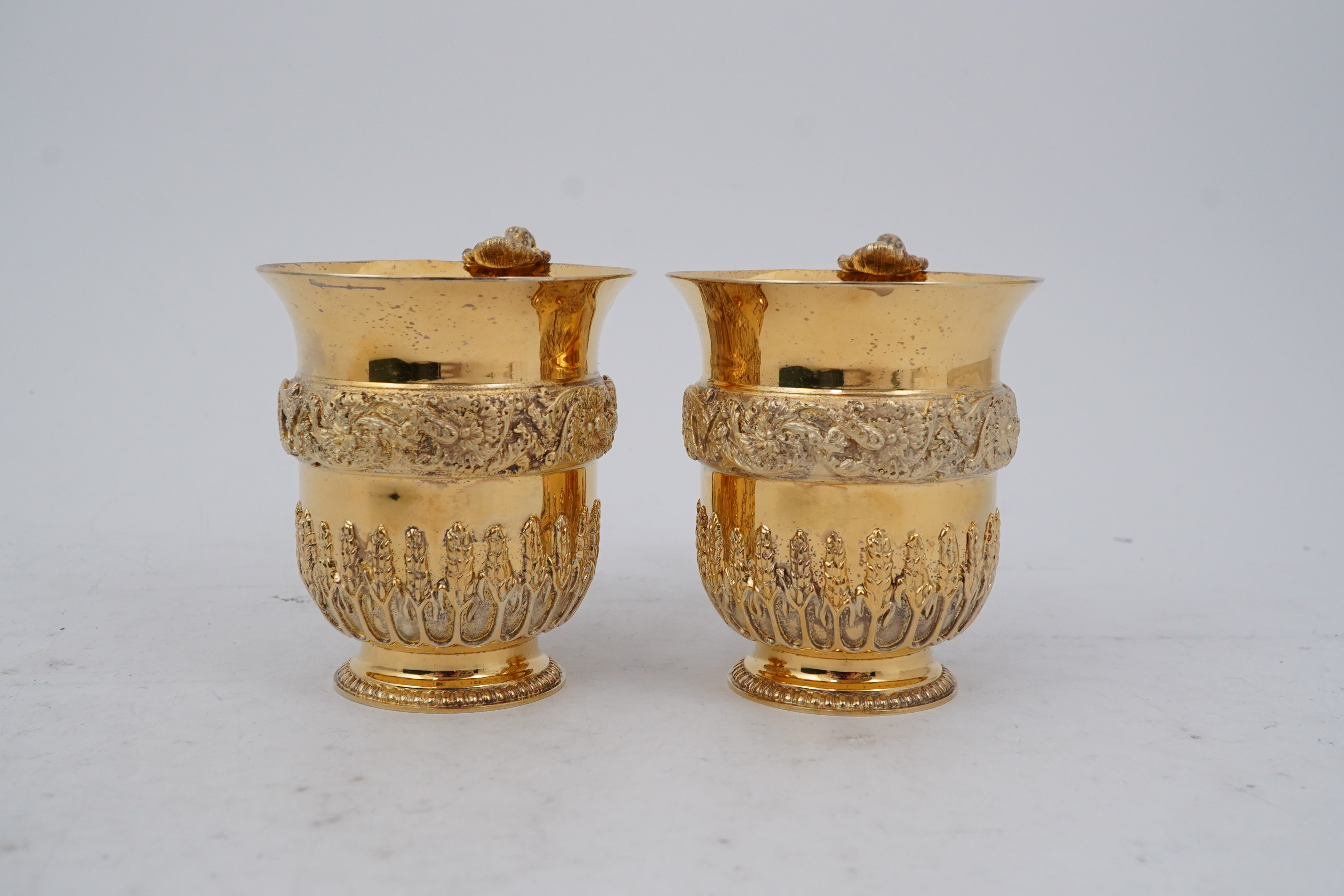 An ornate pair of Elizabeth II silver gilt cups, by Richard O.A. Jarvis